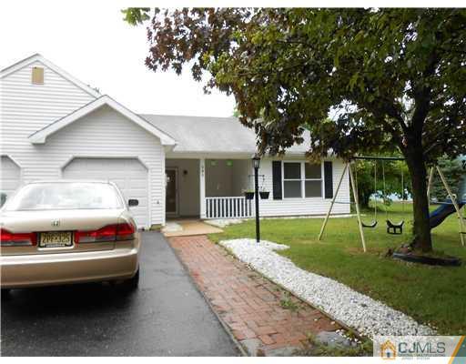 151 Woodbury Road Edison, NJ 08820 - Photo 9 of 15 a couple of cars parked in front of a house