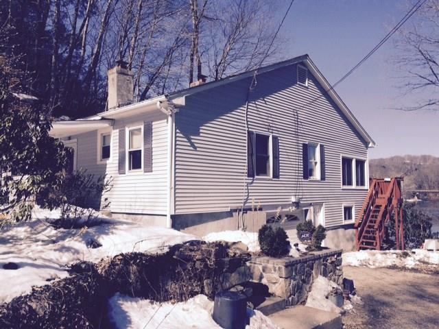 241 Riverside Road Newtown, CT 06482 - Photo 1 of 1 a backyard of a house with table and chairs