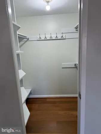 a room with a closet and wooden floor