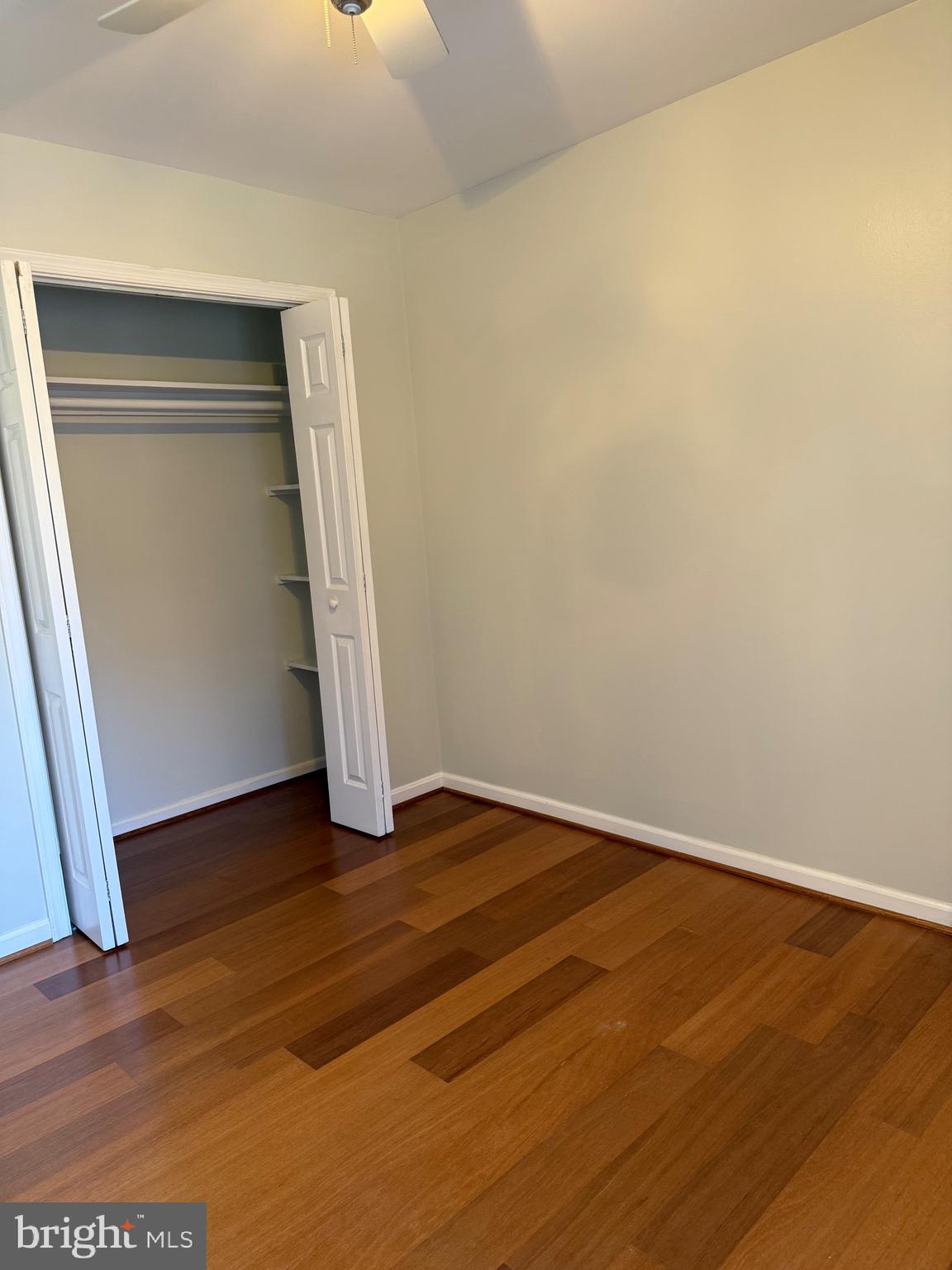 12702 Veirs Mill Road, Unit 51301 Rockville, MD 20853 - Photo 19 of 26 a view of empty room with wooden floor