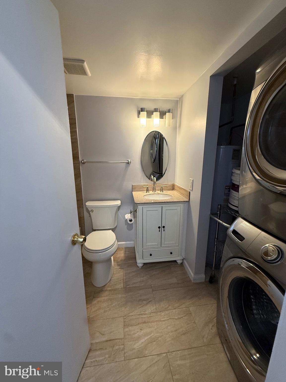 12702 Veirs Mill Road, Unit 51301 Rockville, MD 20853 - Photo 21 of 26 a bathroom with a toilet and a sink
