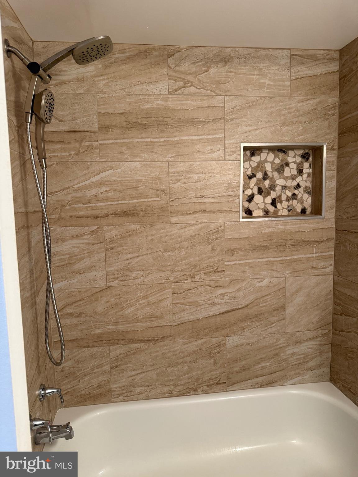 12702 Veirs Mill Road, Unit 51301 Rockville, MD 20853 - Photo 22 of 26 a bathroom with a shower