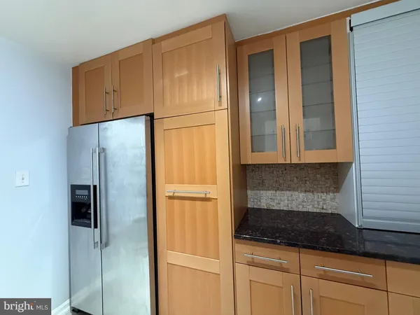 a white refrigerator freezer sitting in a kitchen