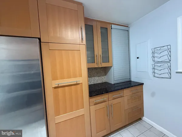 a kitchen with stainless steel appliances a sink dishwasher stove and cabinets