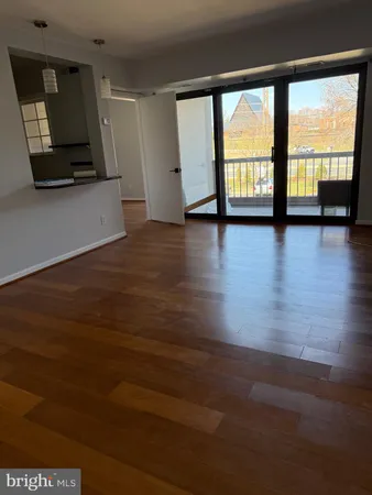 an empty room with wooden floor