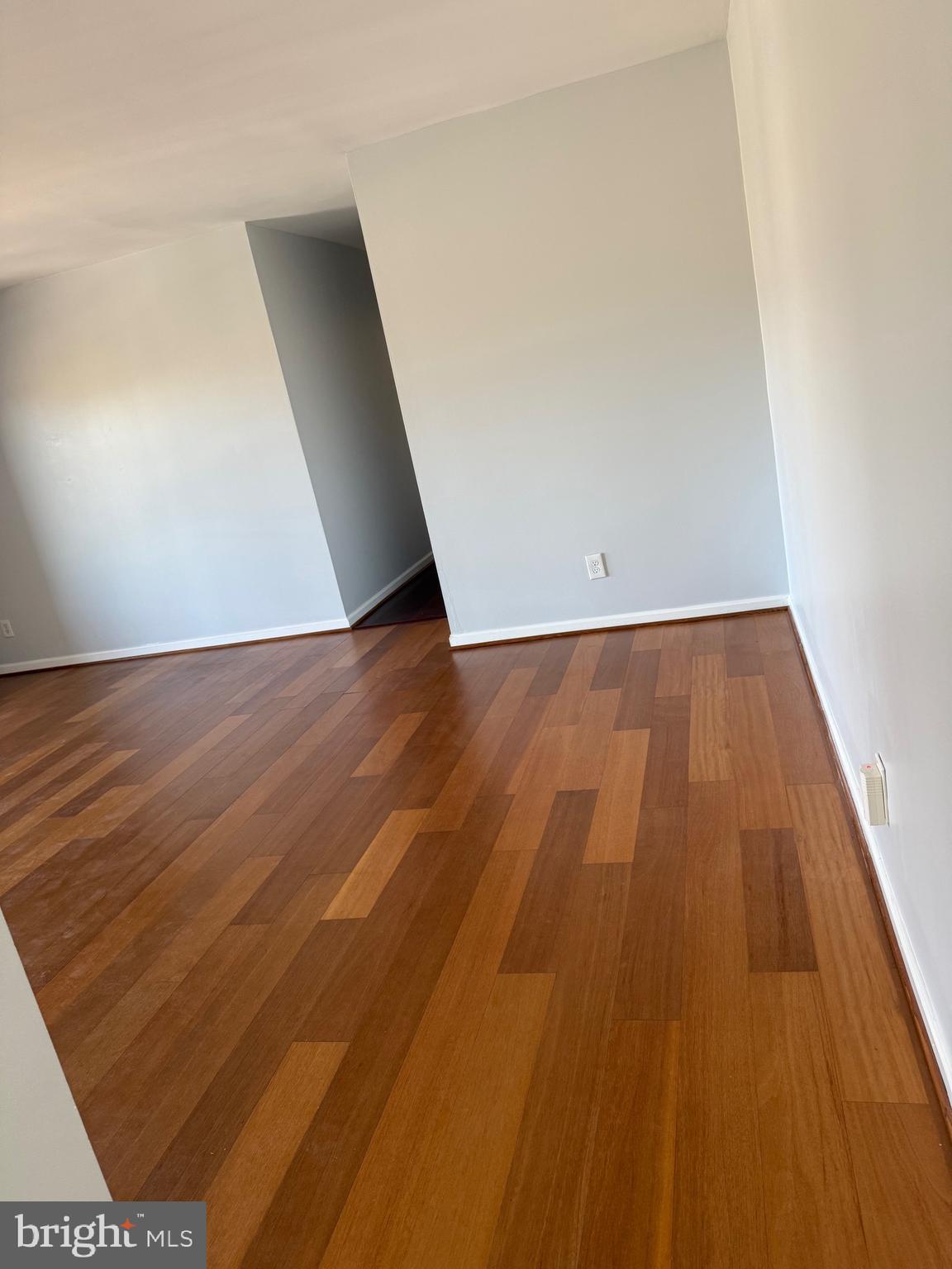 12702 Veirs Mill Road, Unit 51301 Rockville, MD 20853 - Photo 10 of 26 an empty room with wooden floor