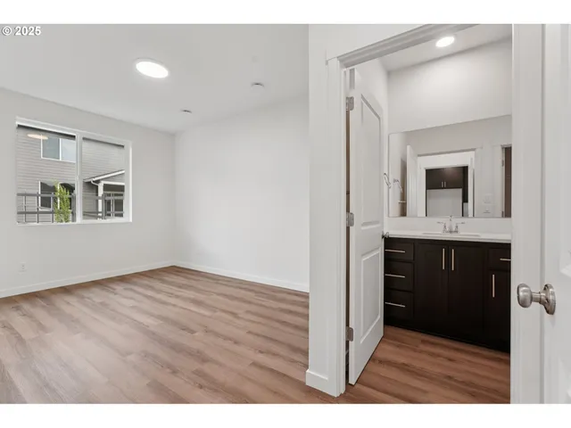 a view of a bathroom from the hallway
