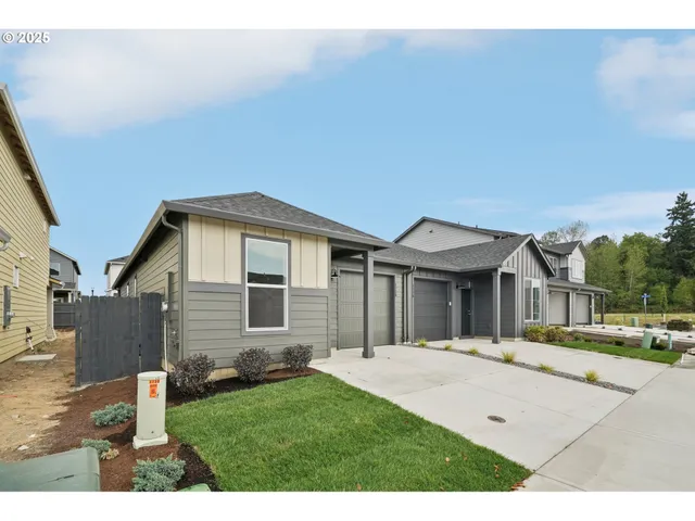 a backyard of a house with yard and seating space