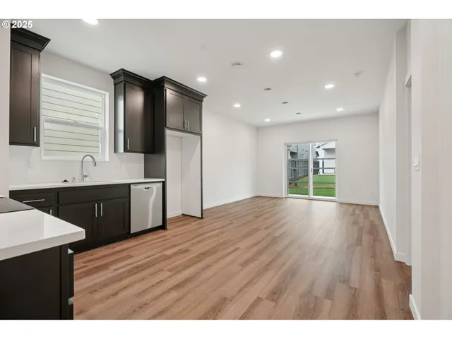 a view of a kitchen with a sink and a window