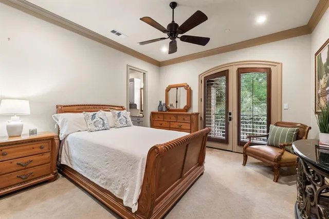 a bedroom with a bed couch and dresser