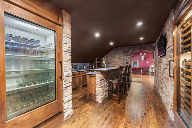 a view of a patio with table and chairs