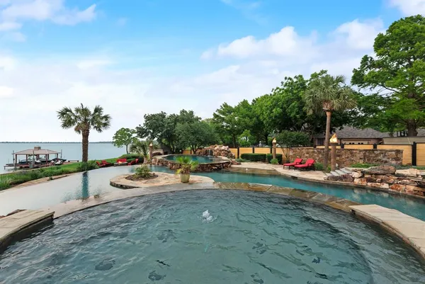 an outdoor space with patio and lake view