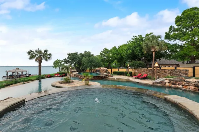 an outdoor space with patio and lake view