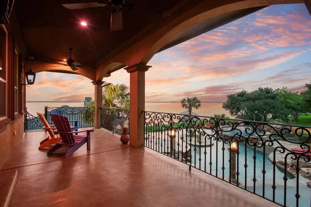 a view of a balcony with chairs