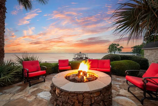 a kitchen with stainless steel appliances granite countertop a refrigerator and a stove