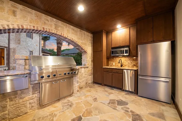a living room with furniture gym equipment and a fireplace