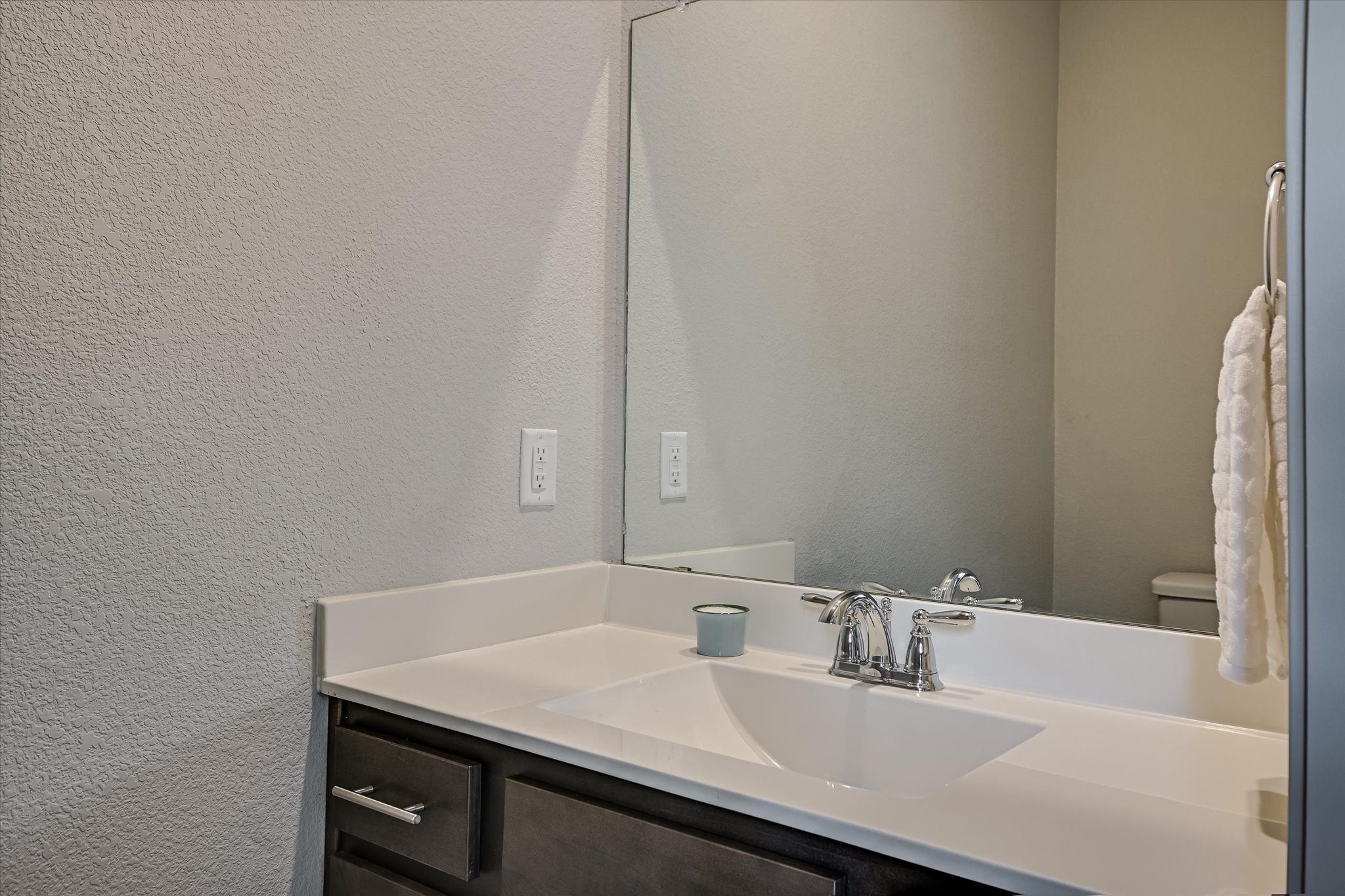 5613 Charles Merle Dr. Austin, TX 78747 - Photo 9 of 34 a bathroom with a sink and a mirror