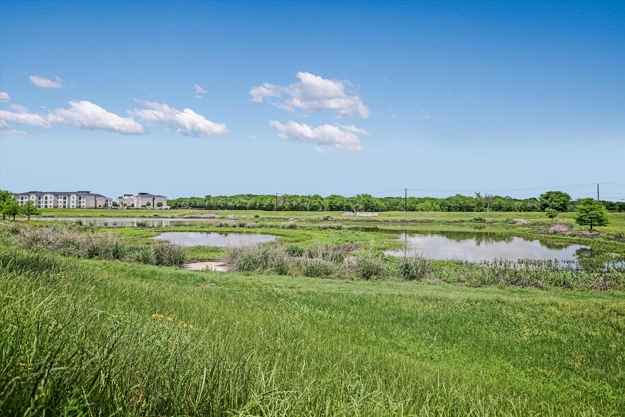5613 Charles Merle Dr. Austin, TX 78747 - Photo 22 of 34 a view of a lake with a big yard