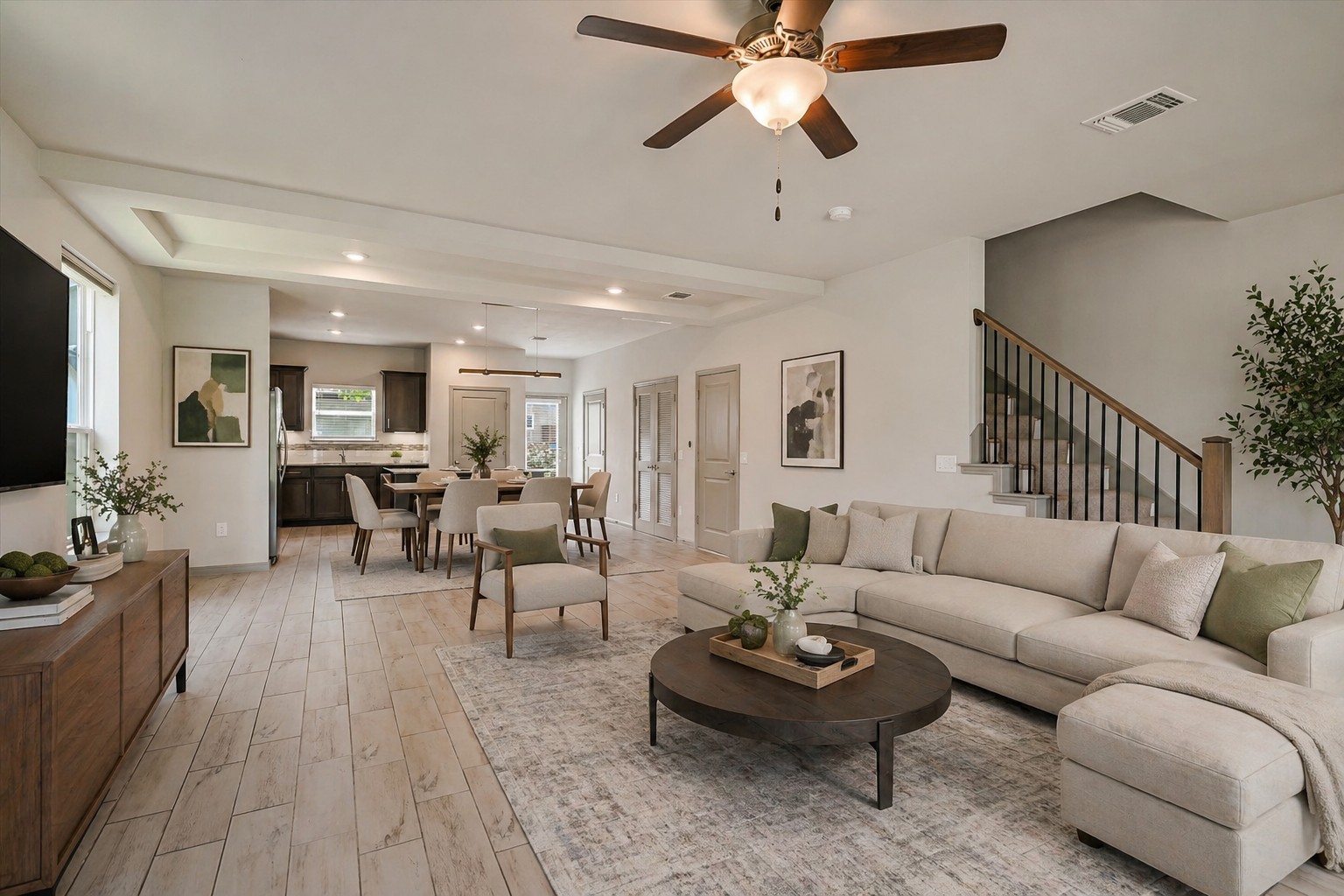 5613 Charles Merle Dr. Austin, TX 78747 - Photo 33 of 34 a living room with furniture kitchen view and a wooden floor