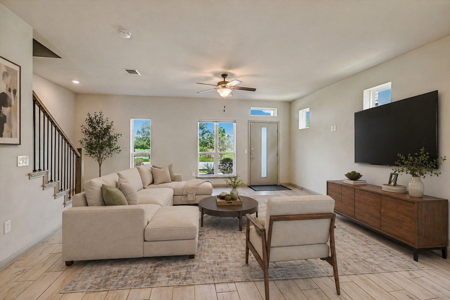 5613 Charles Merle Dr. Austin, TX 78747 - Photo 3 of 34 a living room with furniture and a flat screen tv