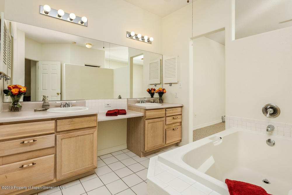 17 Pine Ridge Road Basalt, CO 81621 - Photo 11 of 28 a bathroom with a tub a sink and a mirror