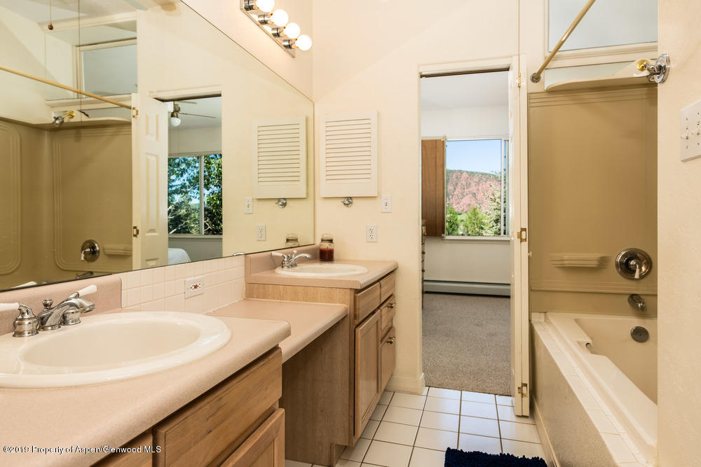 17 Pine Ridge Road Basalt, CO 81621 - Photo 12 of 28 a bathroom with a granite countertop sink mirror bathtub and shower