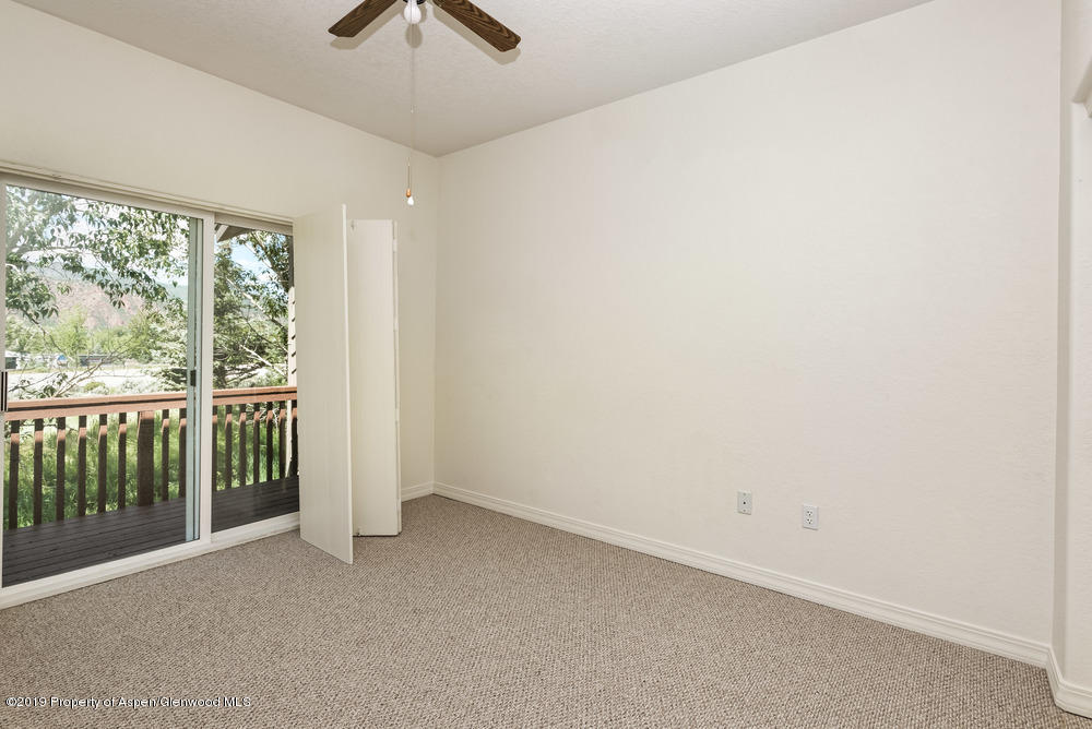 17 Pine Ridge Road Basalt, CO 81621 - Photo 14 of 28 an empty room with a ceiling fan and a window