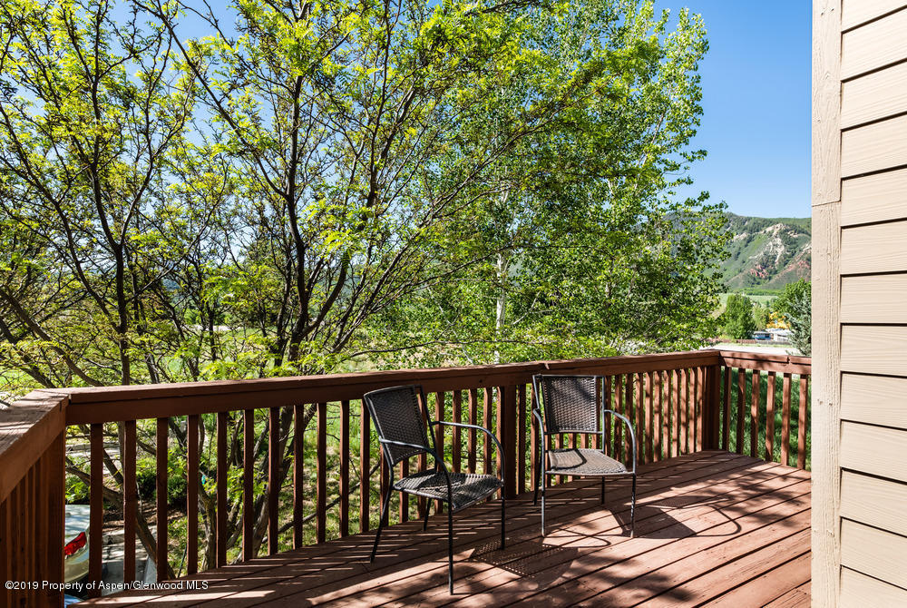 17 Pine Ridge Road Basalt, CO 81621 - Photo 18 of 28 a balcony with wooden floor and fence