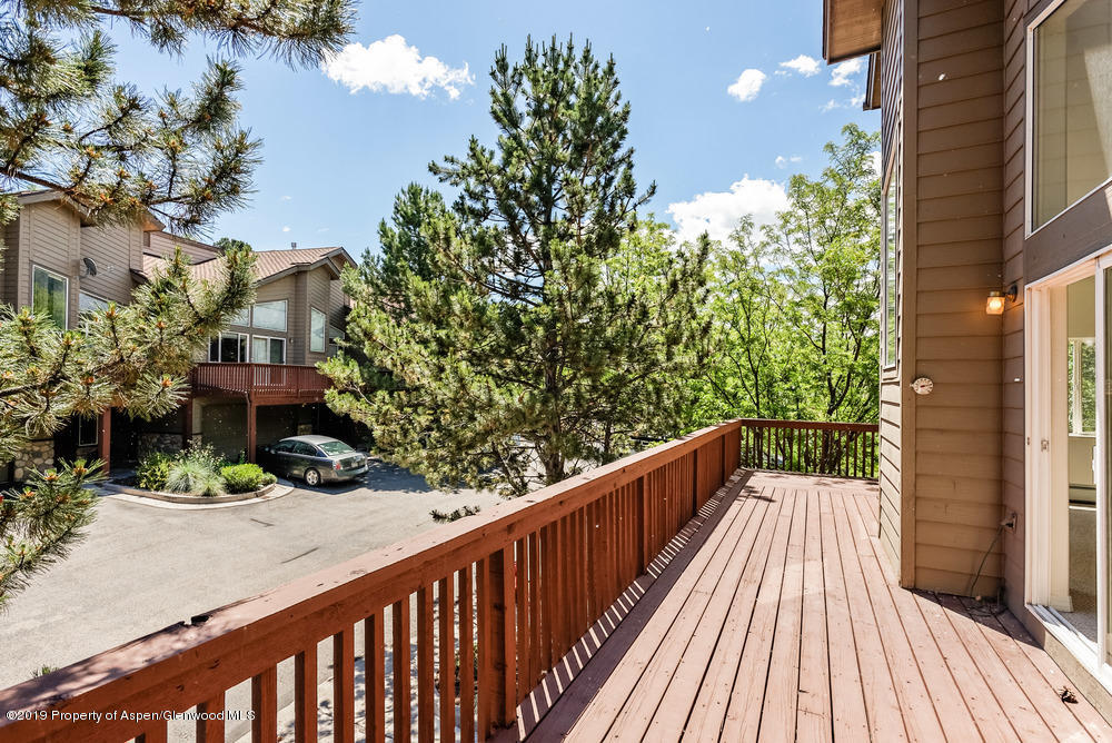17 Pine Ridge Road Basalt, CO 81621 - Photo 22 of 28 a balcony with wooden floor and fence