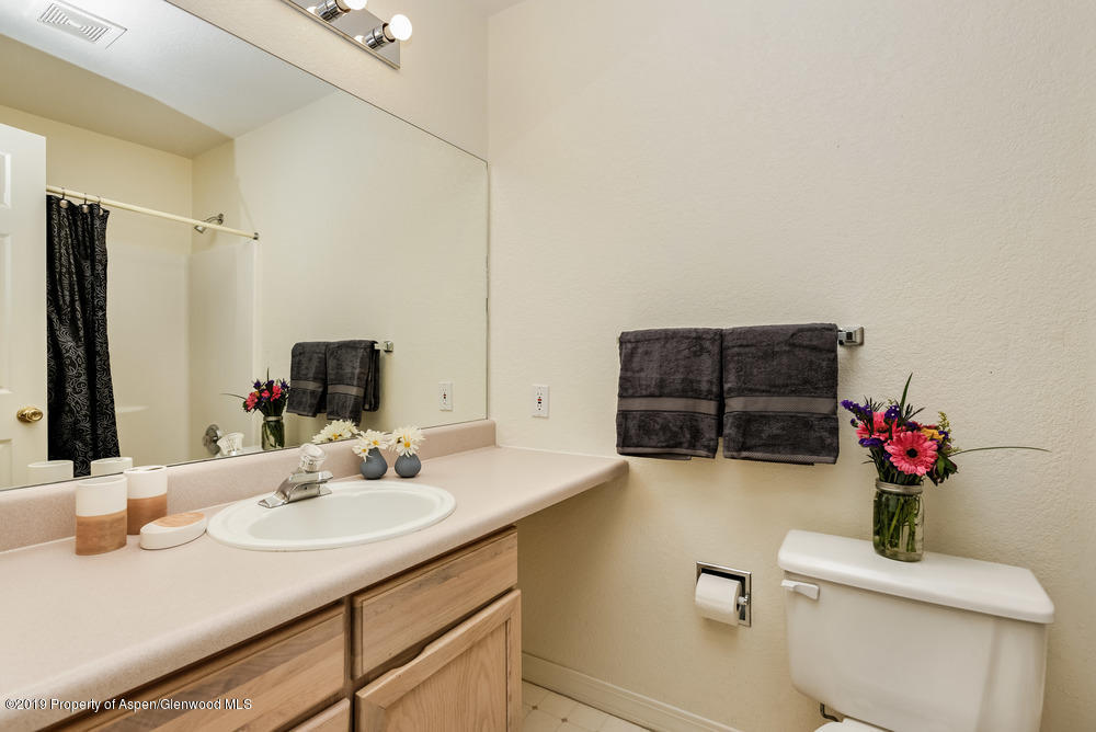17 Pine Ridge Road Basalt, CO 81621 - Photo 24 of 28 a bathroom with a sink vanity granite and a toilet