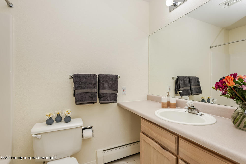 17 Pine Ridge Road Basalt, CO 81621 - Photo 27 of 28 a bathroom with a sink vanity mirror and toilet