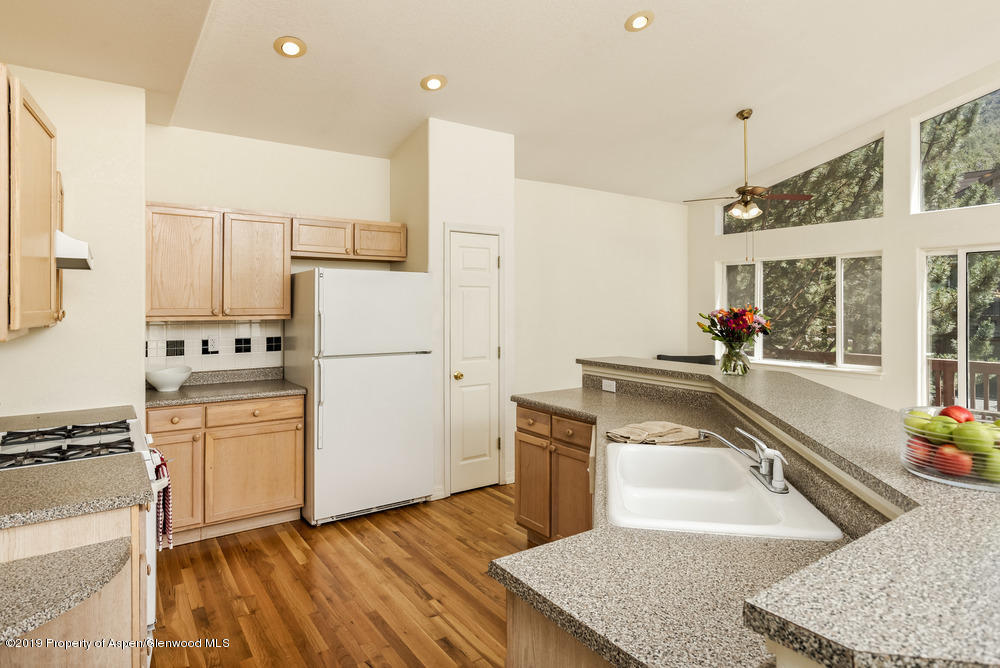 17 Pine Ridge Road Basalt, CO 81621 - Photo 4 of 28 a kitchen with a refrigerator sink and stove