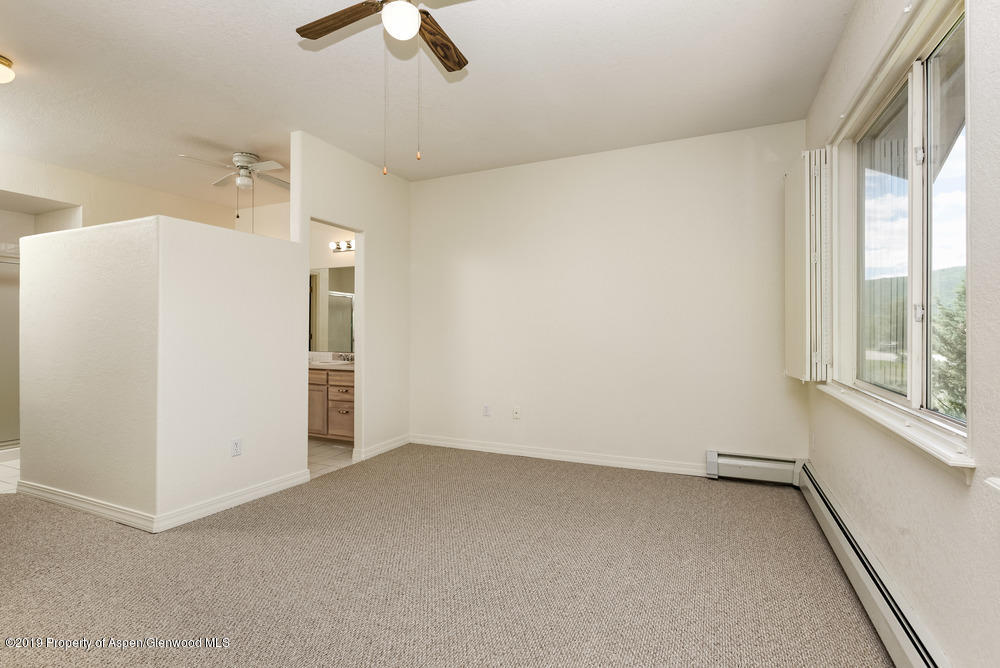 17 Pine Ridge Road Basalt, CO 81621 - Photo 10 of 28 a view of a room with a ceiling fan and window