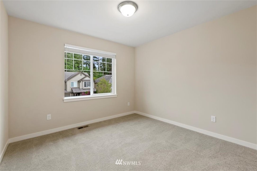 23004 44th Drive Southeast Bothell, WA 98021 - Photo 22 of 29 an empty room with windows