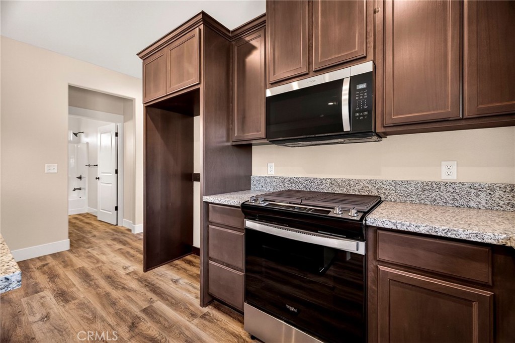 7083 Pentz Road Paradise, CA 95969 - Photo 14 of 46 a kitchen with granite countertop cabinets and steel stainless steel appliances