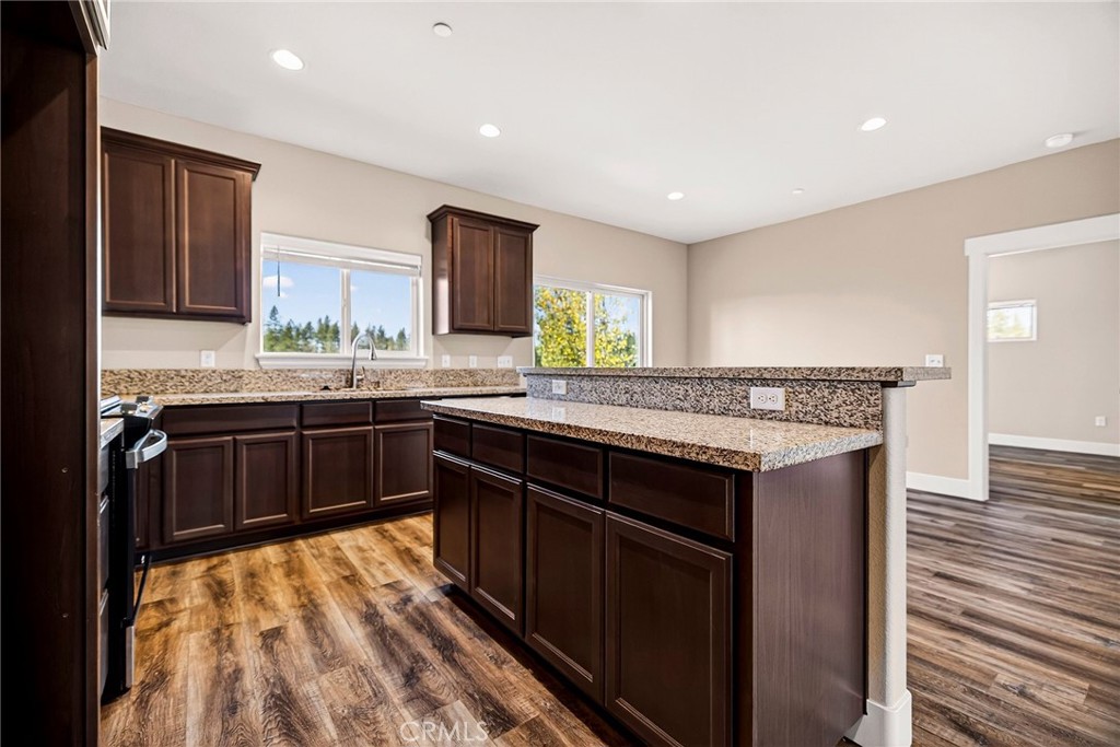 7083 Pentz Road Paradise, CA 95969 - Photo 18 of 46 a kitchen with a sink and a wooden cabinets