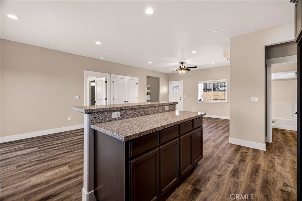 7083 Pentz Road Paradise, CA 95969 - Photo 19 of 46 a kitchen with a stove and a wooden floor