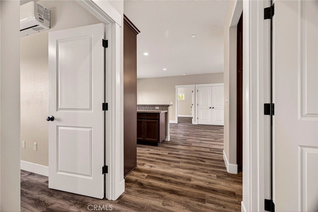 7083 Pentz Road Paradise, CA 95969 - Photo 22 of 46 a view of a hallway with wooden floor and staircase
