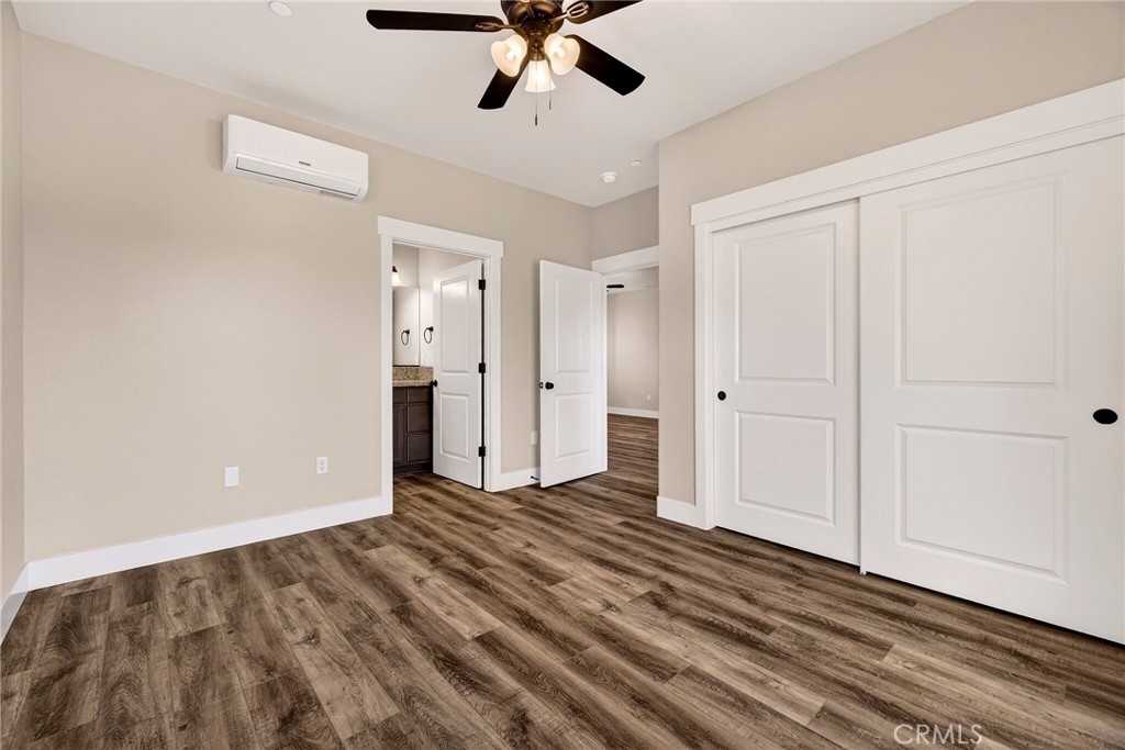 7083 Pentz Road Paradise, CA 95969 - Photo 25 of 46 a view of a livingroom with a chandelier fan and wooden floor