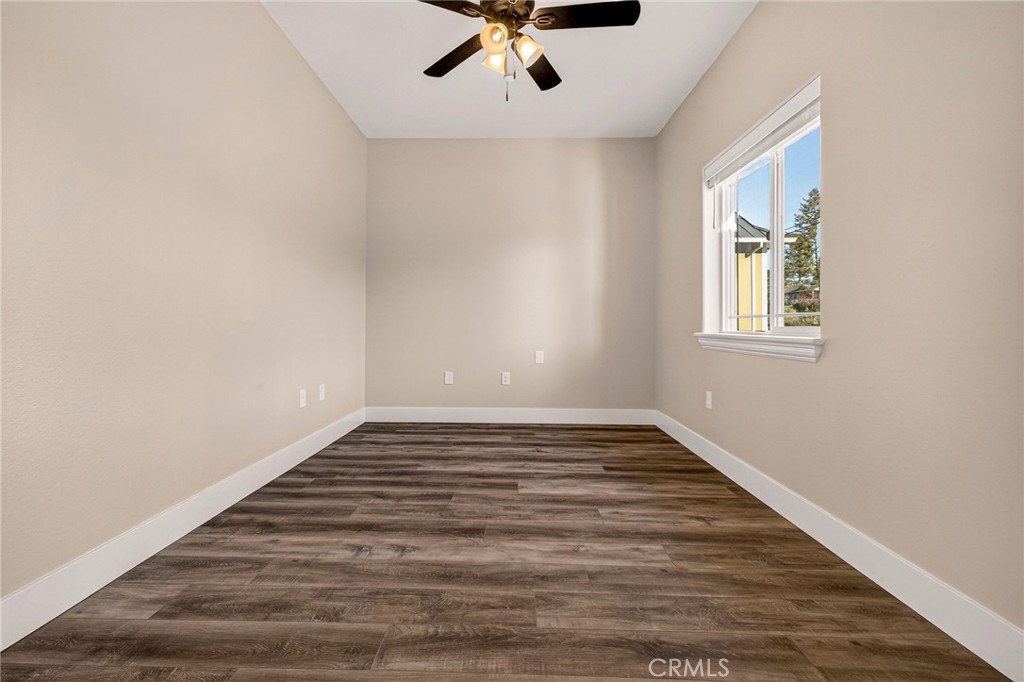 7083 Pentz Road Paradise, CA 95969 - Photo 29 of 46 wooden floor in an empty room with a window