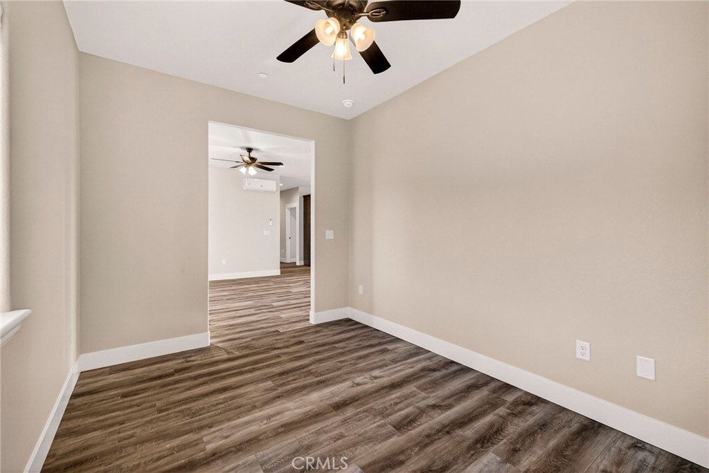 7083 Pentz Road Paradise, CA 95969 - Photo 31 of 46 wooden floor in an empty room with a window