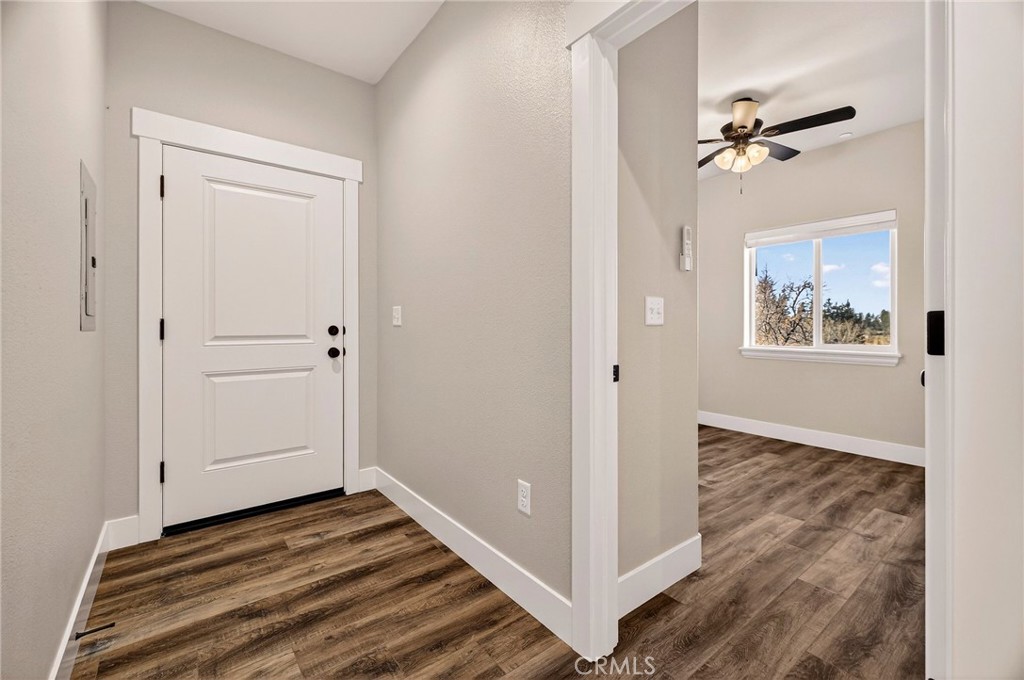 7083 Pentz Road Paradise, CA 95969 - Photo 36 of 46 a view of a livingroom with wooden floor and closet