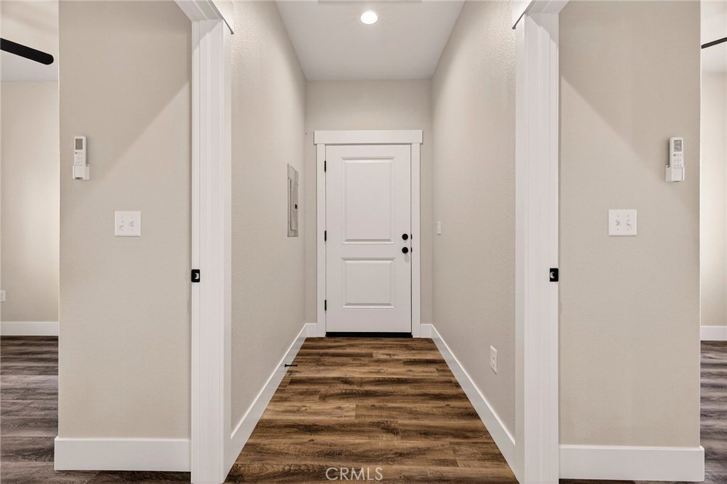 7083 Pentz Road Paradise, CA 95969 - Photo 37 of 46 a view of a hallway with wooden floor and staircase