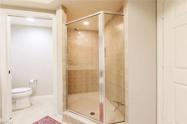 a bathroom with a glass shower door