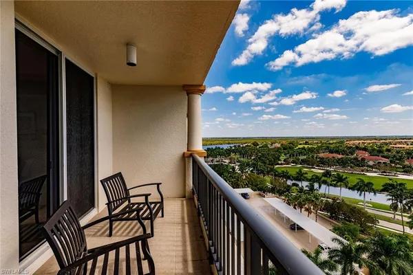 a view of a balcony with an outdoor seating