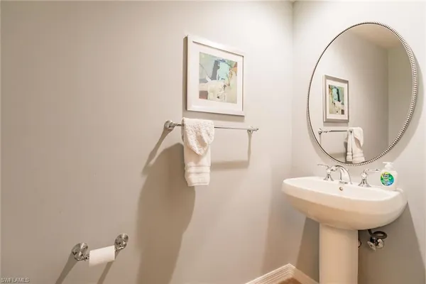a bathroom with a sink and mirror