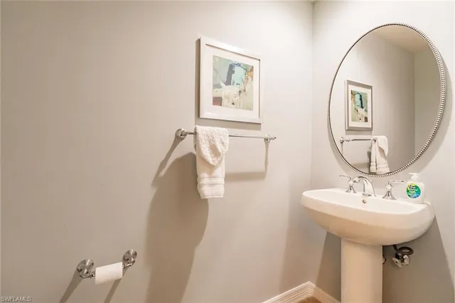 a bathroom with a sink and mirror