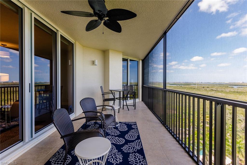 1065 Borghese Lane, Unit 1003 Naples, FL 34114 - Photo 32 of 43 a balcony view with a seating space