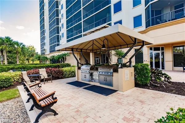 a view of a patio with a table and chairs
