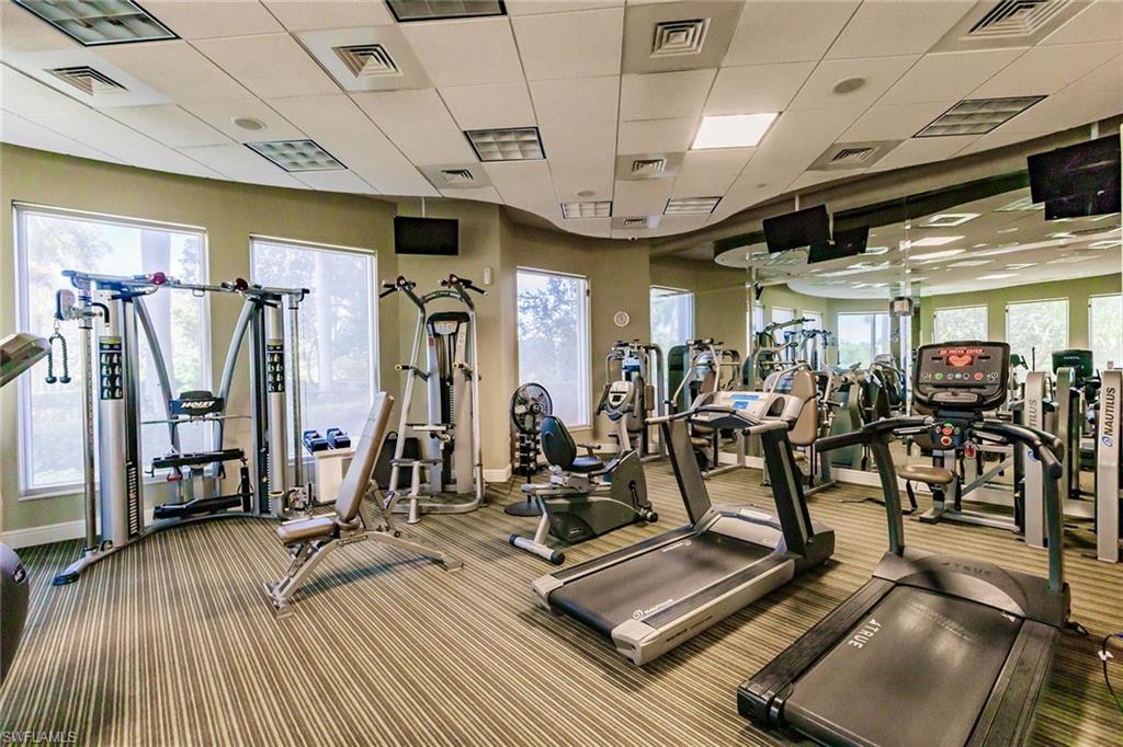 1065 Borghese Lane, Unit 1003 Naples, FL 34114 - Photo 41 of 43 a view of a room with gym equipment